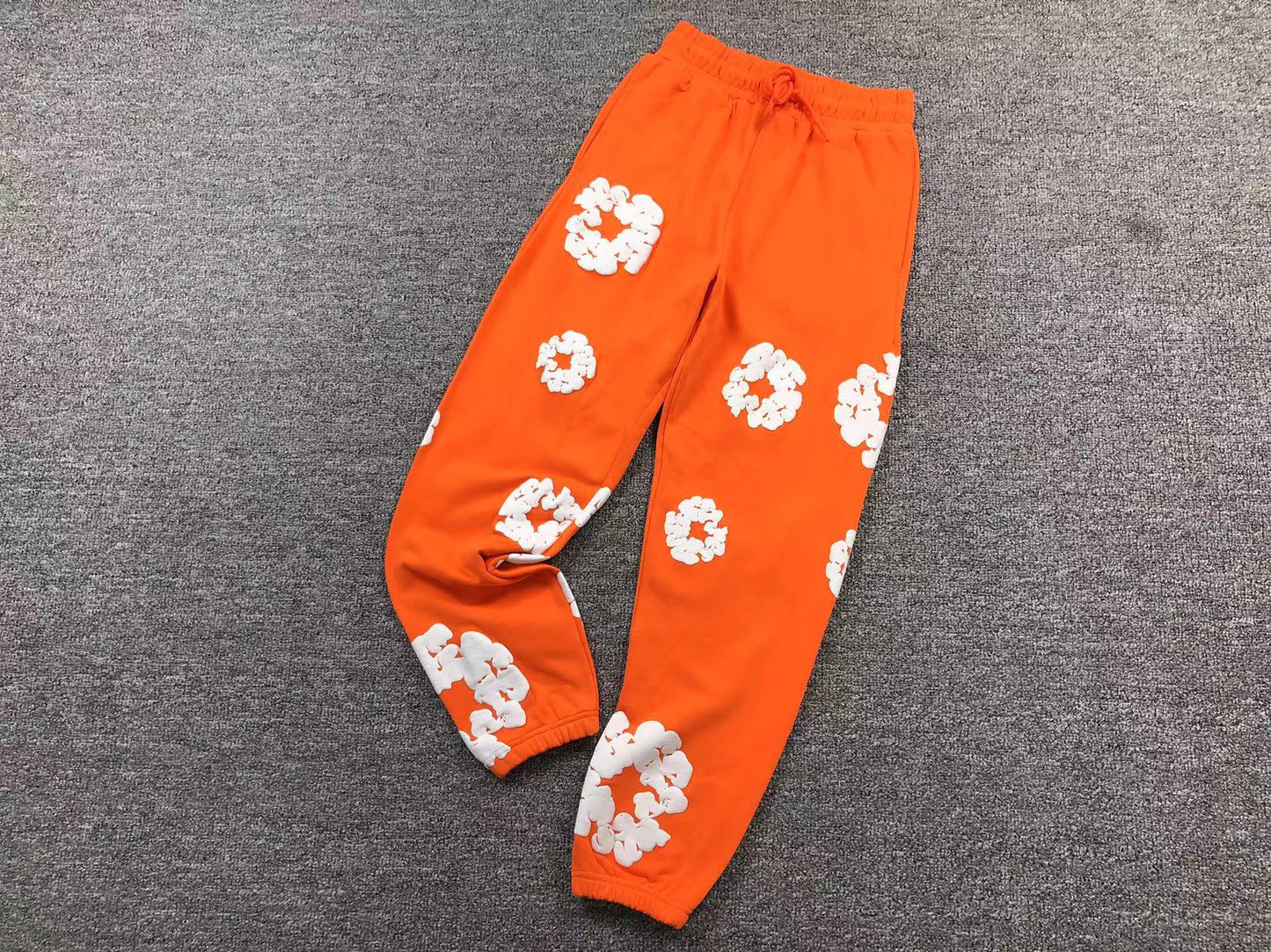 DENIM TEARS PANTS ORANGE/WHITE